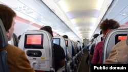 Passengers relax during a flight.