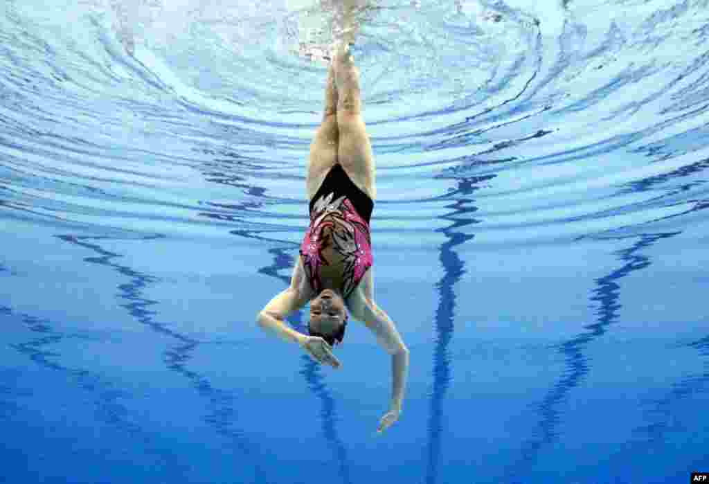 July 20: Israel's Anastasia Gloushkov performs during the synchronised swimming solo final at the 14th FINA World Championships in Shanghai. REUTERS/Christinne Muschi