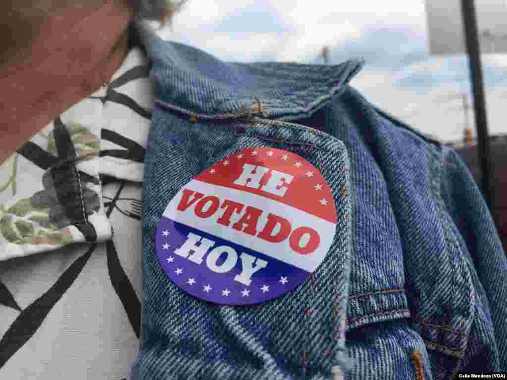 Carmen Carrión leaves a polling precinct wearing a Spanish language "I voted" sticker, Philadelphia, Pa., April 26, 2016.