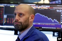 Specialist Meric Greenbaum works on the floor of the New York Stock Exchange, Feb. 2, 2018.