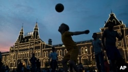 People play soccer at the Red Square during the 2018 soccer World Cup in Moscow, Russia, June 19, 2018.