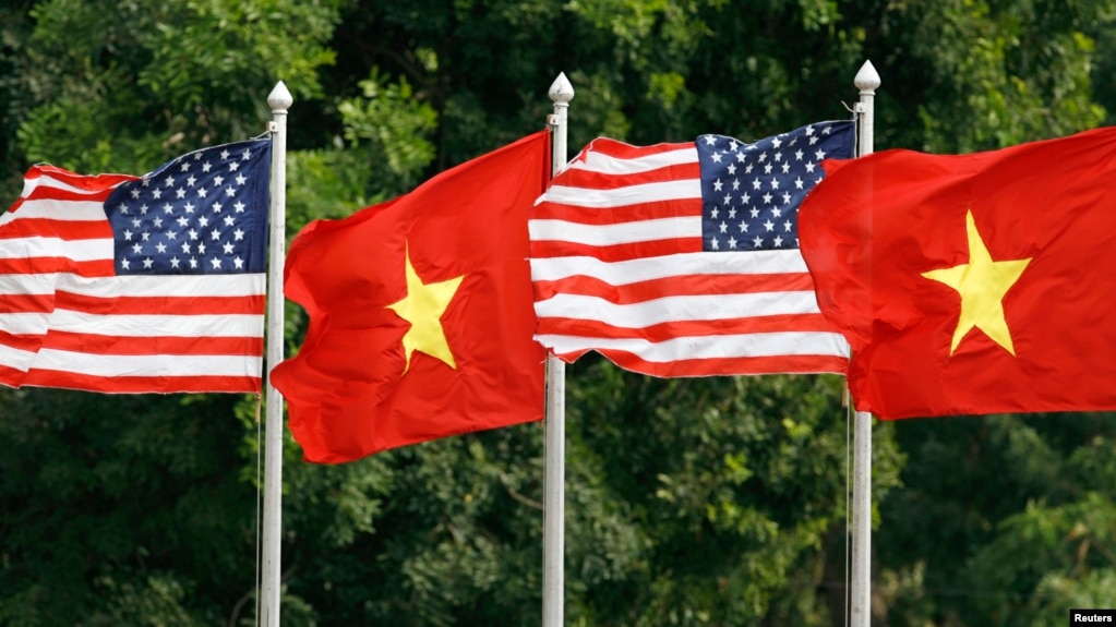 FILE U.S. and Vietnamese flags flutter in the wind at the presidential palace in Hanoi where U.S. President George W. Bush is visiting November 17, 2006. 