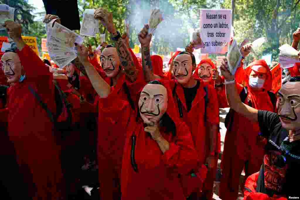 Nissan workers dressed in costumes from &quot;La Casa de Papel (Money Heist)&quot; take part in a protest outside Spanish parliament in Madrid.