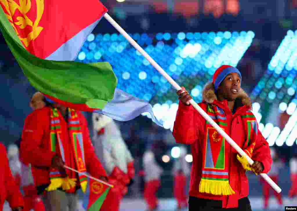 Shannon-Obgnai Abeda of Eritrea carries the national flag with delegates during the Pyeongchang 2018 Olympic Winter Games Opening Ceremony at Pyeongchang Olympic Stadium.