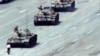 FILE - A Beijing citizen stands in front of tanks on the Avenue of Eternal Peace, June 5, 1989.