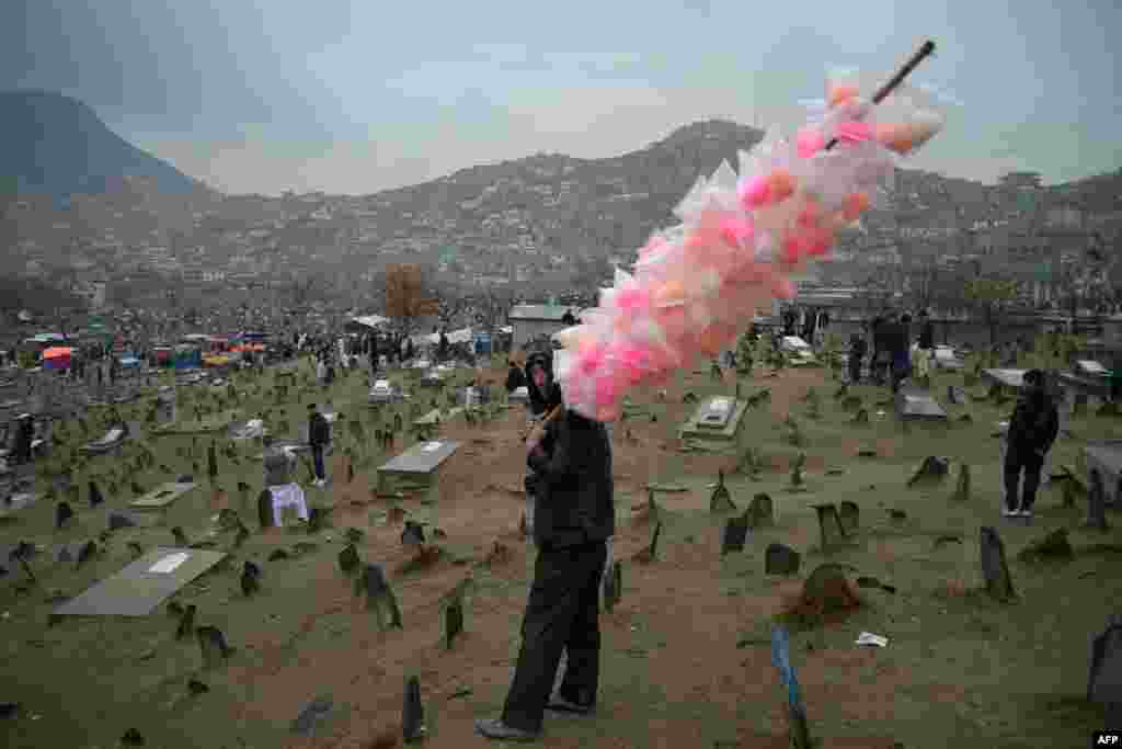 A vendor sells candy floss in Kabul during the Afghan New Year (Nowruz) festivities.