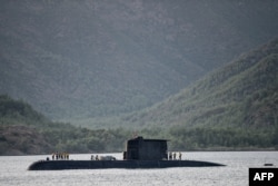 A Turkish navy submarine cruises on Sept. 20, 2017, off the Turkish Naval base of Aksaz in Marmaris, during a NATO submarine escape and rescue exercise.