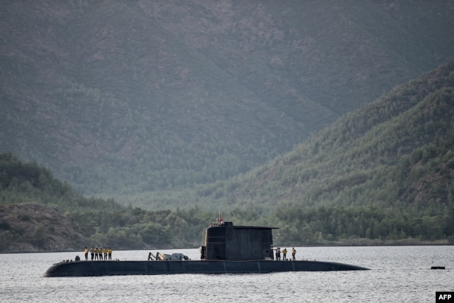 A Turkish navy submarine cruises on Sept. 20, 2017, off the Turkish Naval base of Aksaz in Marmaris, during a NATO submarine escape and rescue exercise.