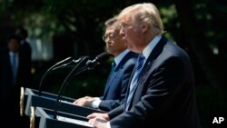 President Donald Trump, accompanied by South Korean President Moon Jae-in, speaks in the Rose Garden of the White House in Washington, June 30, 2017. 