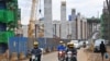 FILE - Motorists drive next to the ongoing construction site of the Nairobi Expressway, undertaken by the China Road and Bridge Corp., in Nairobi, Kenya, July 12, 2021. As Africa's biggest investor, China has been responsible for major infrastructure projects in Kenya.