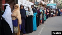 Women stand in a line at a voting center to cast their ballot during the general election in Dhaka, Bangladesh, Dec. 30, 2018.