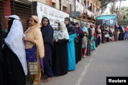 Women stand in a line at a voting center to cast their ballot during the general election in Dhaka, Bangladesh, Dec. 30, 2018.