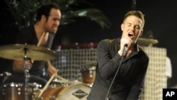 Singer Brandon Flowers and drummer Ronnie Vannucci of The Killers performs during Coachella Valley Music & Arts Festival in Indio, California
