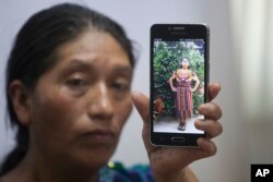 Dominga Vicente shows a photo of her niece, 20-year-old Claudia Patricia Gomez Gonzalez, who was killed by an agent of the U.S. Border Patrol in Nuevo Laredo, Texas, May 23, 2018.