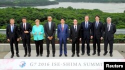 World leaders pose for a group photo on the first day of the G7 meetings in Ise Shima, Japan, May 26, 2016. 