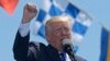 Defiant Trump Slams Critics During Coast Guard Commencement Speech