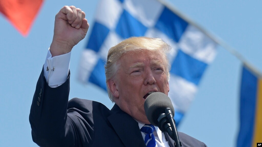  Trump slams critics, media at Coast Guard Academy 