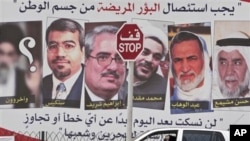 In this Sunday, May 8, 2011 file photo, a car passes a pro-government billboard in Muharraq, Bahrain, with pictures of jailed Bahraini Shiite and Sunni opposition leaders