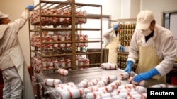 Workers make salami at Akova Impex Meat Industry Ovako, which makes halal-quality certified products, in Sarajevo, Bosnia and Herzegovina, Dec. 2, 2016.