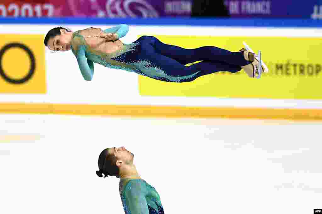 Italy&#39;s Nicole Della Monica and Matteo Guarise compete in the Pair Free Skating during the Internationaux de France ISU Grand Prix of Figure Skating in Grenoble, central-eastern France, Nov. 18, 2017.