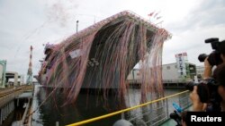 Japan Maritime Self-Defense Force's helicopter destroyer DDH183 Izumo, the largest surface combatant of the Japanese navy, is seen during its launching ceremony in Yokohama, south of Tokyo, Aug. 6, 2013. 