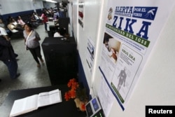 A government campaign poster informing about Zika virus symptoms is seen at the maternity ward of a hospital in Guatemala City, Guatemala, Jan. 28, 2016.