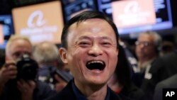 FILE - Jack Ma, founder of Alibaba, smiles during the company's IPO at the New York Stock Exchange in New York, Friday, Sept. 19, 2014.. 