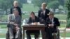 FILE - In this July 26, 1990 file photo, President George H. W. Bush signs the Americans with Disabilities Act during a ceremony on the South Lawn of the White House.