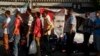 Supporters of deposed Egyptian President Mohamed Morsi stand in a line as volunteers distribute juice ahead of iftar (breaking of fast) during the holy month of Ramadan, as they continue a sit-in around Rabaa Adawiya mosque, east of Cairo, July 17, 2013.