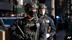 FILE - Counterterrorism officers patrol during an event in New York City, Oct. 5, 2020.