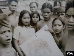 A photo of ethnic minority tribes captured by Michael Vickery during 1960s was displayed in a photo exhibition in Bophana Centre, Thursday October 11, 2018. (Nem Sopheakpanha/VOA Khmer)