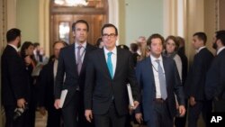 Treasury Secretary Steven Mnuchin arrives at the Capitol for a closed-door meeting with Senate Majority Leader Mitch McConnell, R-Ky, as they struggle to get a tax code overhaul, in Washington, Sept. 12, 2017.