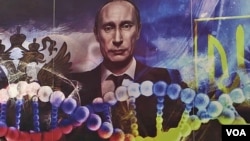 A poster depicting Russian President Vladimir Putin and genetic links in the colors of the Russian and Ukrainian flags is seen at the office of pro-Kremlin youth group SET (Network). (VOA video screengrab)