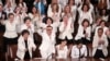At State of the Union, Women in White Stand up or Sit down to Trump