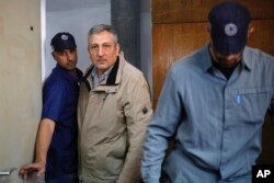 FILE - Nir Hefetz, a longtime media adviser to Israeli Prime Minister Benjamin Netanyahu and his family, arrives to a Magistrate court in Tel Aviv, Israel, Feb. 22, 2018.