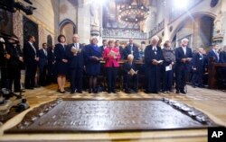 German Chancellor Angela Merkel, center, left, German President Frank-Walter Steinmeier, right, and President of Germany's parliament Bundestag Wolfgang Schaeuble, center right, attend ceremonies for the 500th anniversary of the Reformation