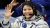 U.S. astronaut Anne McClain waves before the launch of Soyuz MS-11 space ship at the Russian-leased Baikonur cosmodrome, Kazakhstan, Dec. 3, 2018.