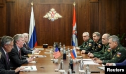 Delegations, led by Russia's Defencs Minister Sergei Shoigu (R) and U.S. National Security Adviser John Bolton (2nd L), meet in Moscow, Russia, Oct. 23, 2018.