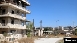 A view shows what is believed to be the road that civilians would have to use to access one of the safe exit points opened for civilians wishing to leave rebel-held areas, in Aleppo's Bustan al-Qasr, Syria July 29, 2016. 