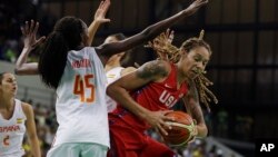 United States center Brittney Griner goes up against the defense of Spain forward Astou Ndour during the first half of a women's basketball game at the Youth Center at the 2016 Summer Olympics in Rio de Janeiro, Brazil, Aug. 8, 2016. 