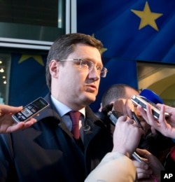Russian Energy Minister Alexander Novak speaks with the media as he arrives at EU headquarters in Brussels, March 2, 2015.