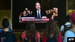 Students at the University of Southern California watch a live telecast of the testimony from Brett Kavanaugh concerning sexual assault allegations from Christine Blasey Ford, Sept. 27, 2018, at the Annenberg School for Communications and Journalism in Los Angeles.