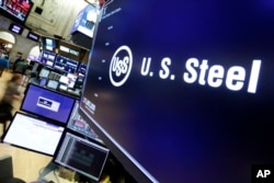 The logo for U.S. Steel appears above a trading post on the floor of the New York Stock Exchange, March 2, 2018. President Donald Trump on Friday insisted that "trade wars are good, and easy to win."