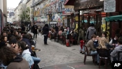 Customers drink beers at cafe terraces in Paris, May, 19, 2021. Cafe and restaurant terraces reopened Wednesday after a six-month coronavirus shutdown deprived residents of the essence of French lifestyle — sipping coffee and red wine with friends.(AP Pho