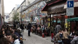 Customers drink beers at cafe terraces in Paris, May, 19, 2021. Cafe and restaurant terraces reopened Wednesday after a six-month coronavirus shutdown deprived residents of the essence of French lifestyle — sipping coffee and red wine with friends.(AP Photo)