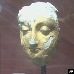 A sculpture more than 1,500 years old, still covered in gold leaf, on display at the Kabul Museum