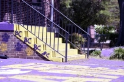 A courtyard typically teaming with Benedict College students is empty, except for one school employee, on Friday, April 3, 2020, in Columbia, S.C.