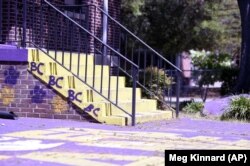A courtyard typically teaming with Benedict College students is empty, except for one school employee, on Friday, April 3, 2020, in Columbia, S.C.