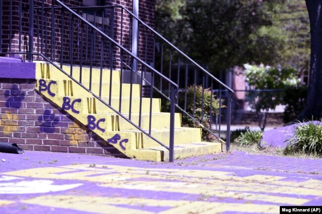 A courtyard typically teaming with Benedict College students is empty, except for one school employee, on Friday, April 3, 2020, in Columbia, S.C.