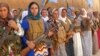 在科巴内拿枪抗击“伊斯兰国”激进分子的库尔德女子。